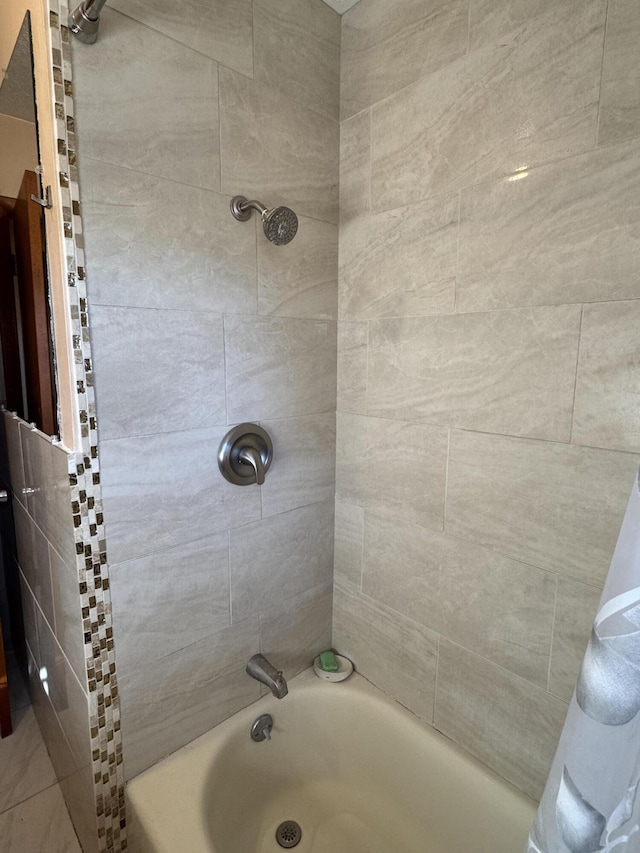 bathroom with shower / bathing tub combination