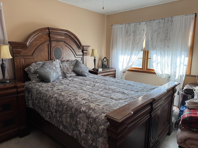 bedroom featuring light tile patterned floors