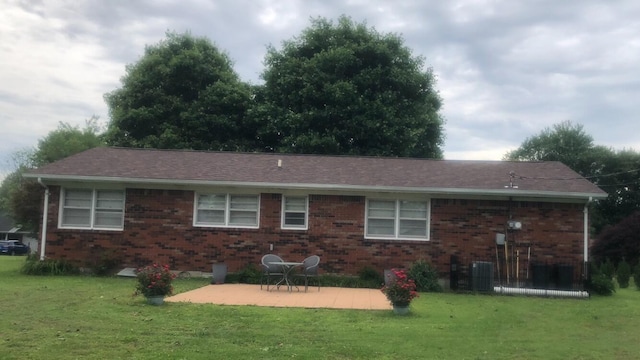 149 Cherokee Ave, Russell Springs, KY 42642 - back of property with a patio, brick siding, and a lawn