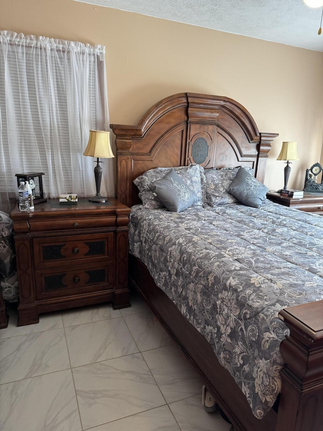 bedroom with marble finish floor