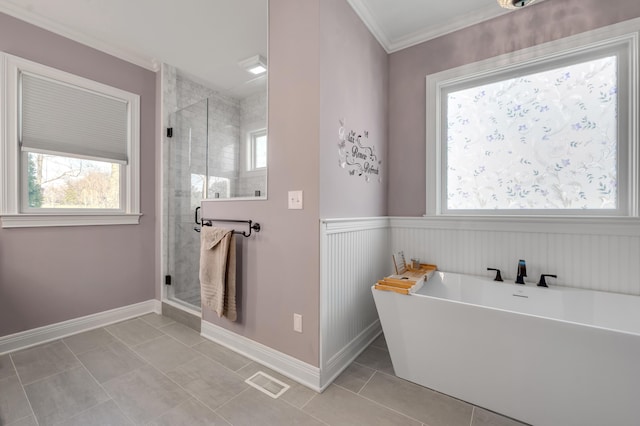 bathroom with a stall shower, visible vents, a soaking tub, ornamental molding, and tile patterned floors