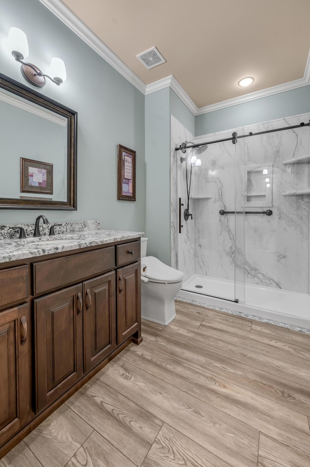 full bath featuring toilet, a marble finish shower, visible vents, and crown molding