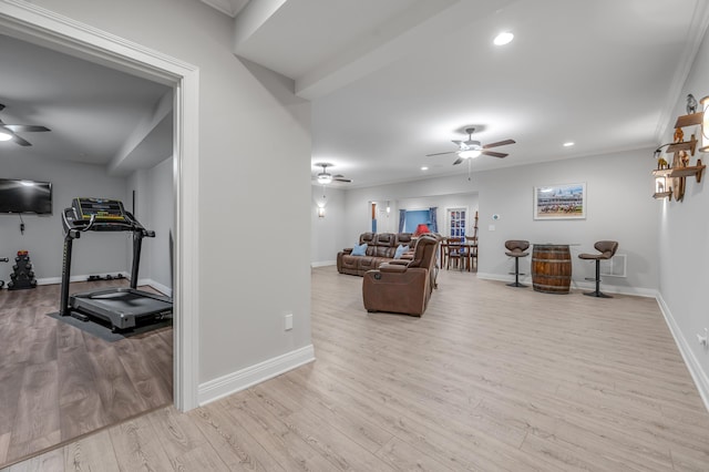 living area featuring ceiling fan, baseboards, wood finished floors, and recessed lighting