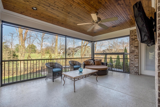 sunroom / solarium with wooden ceiling and ceiling fan