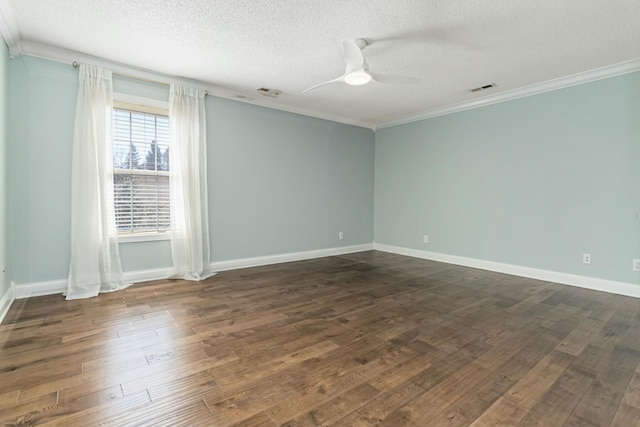 unfurnished room featuring ceiling fan, visible vents, dark wood-style flooring, and ornamental molding