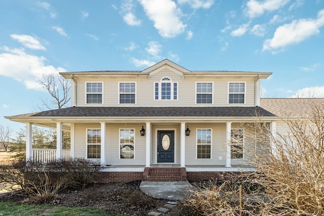 view of front of house featuring covered porch and roof with shingles