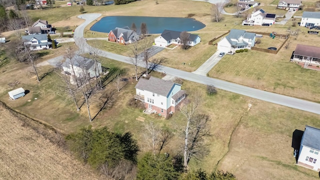 bird's eye view featuring a water view and a residential view