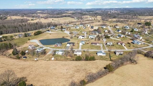 drone / aerial view featuring a water view and a residential view