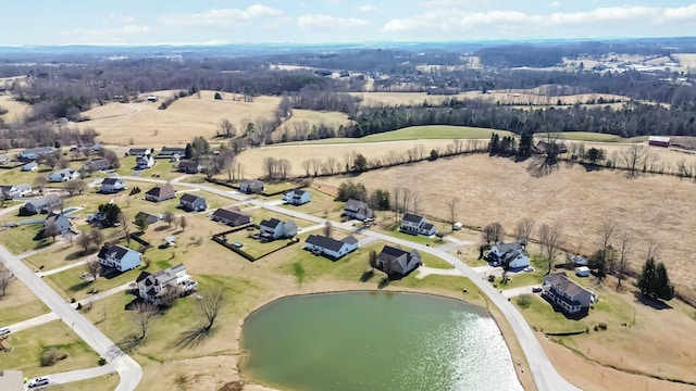 aerial view with a rural view and a water view