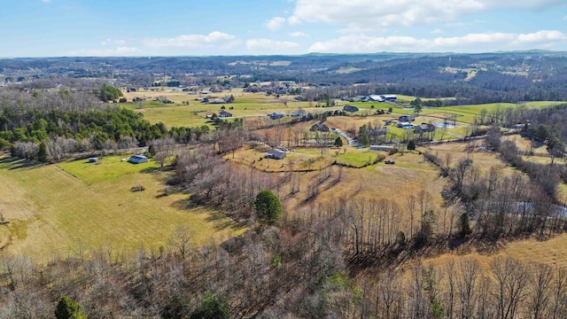 birds eye view of property featuring a rural view