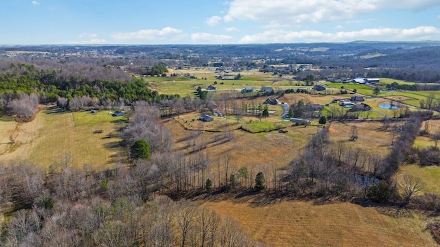 birds eye view of property featuring a rural view