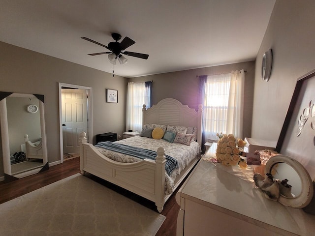 bedroom featuring dark wood-style floors and ceiling fan