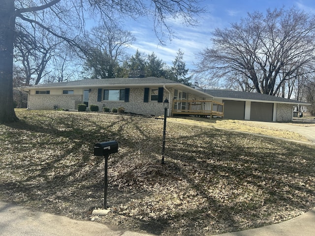 ranch-style house featuring driveway and an attached garage