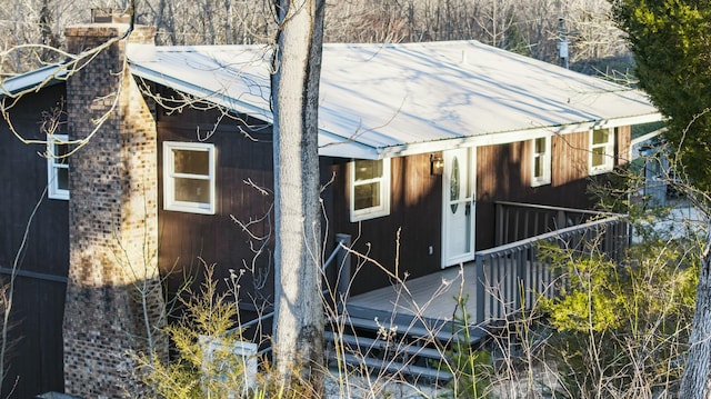 exterior space featuring metal roof