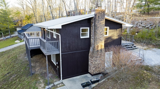 view of home's exterior with a chimney