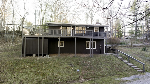 back of property with a deck