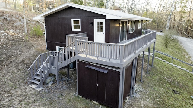 view of outdoor structure featuring stairs