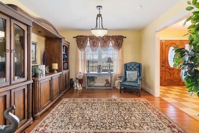 sitting room featuring wood finished floors and baseboards