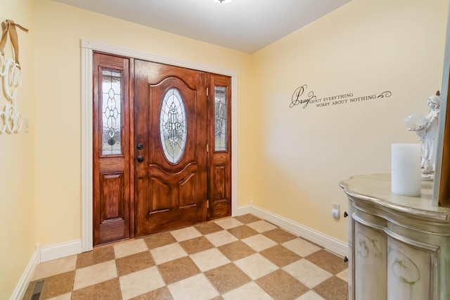 entryway featuring light floors, visible vents, and baseboards