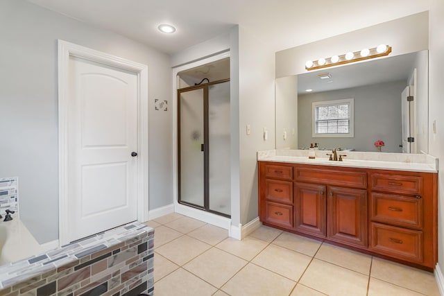 full bathroom with baseboards, a shower stall, vanity, and tile patterned floors