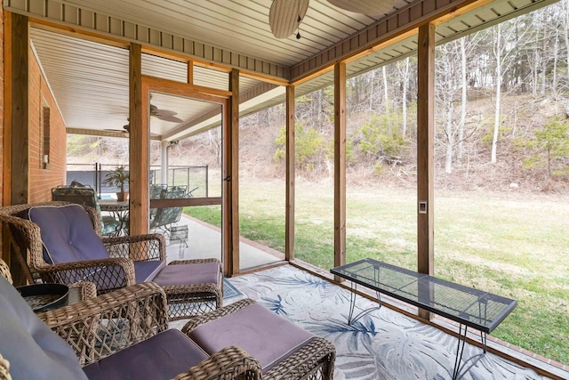 sunroom with a ceiling fan