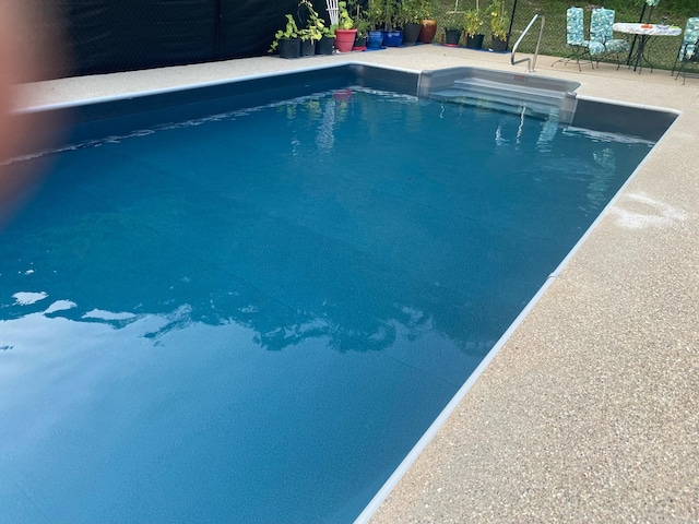 pool featuring a patio area