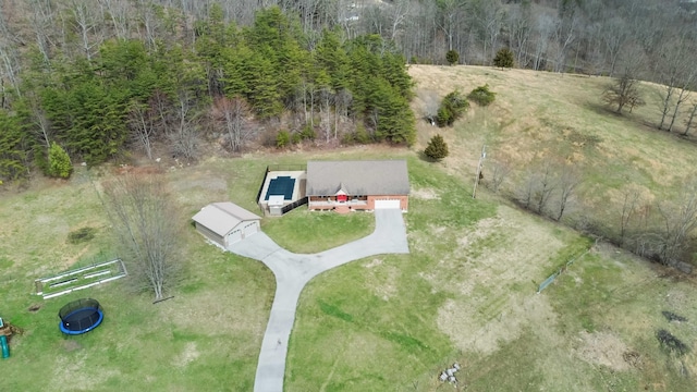 aerial view featuring a wooded view