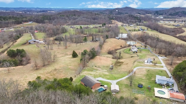 drone / aerial view featuring a rural view and a mountain view