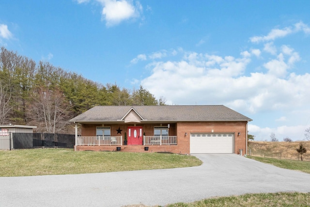 single story home with a porch, a garage, brick siding, driveway, and a front lawn