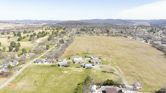 drone / aerial view with a mountain view and a rural view