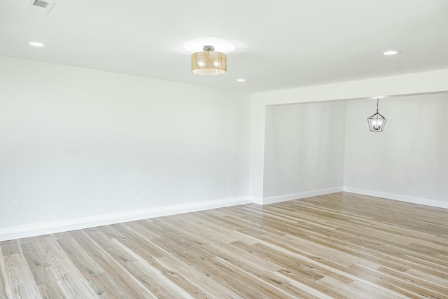 spare room with recessed lighting, baseboards, visible vents, and light wood finished floors