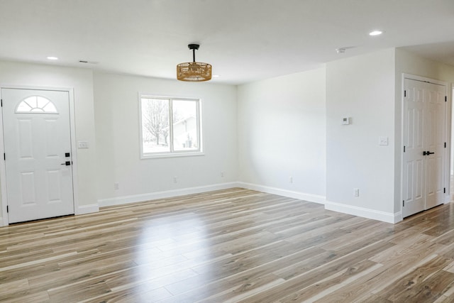 entryway with recessed lighting, baseboards, and light wood finished floors