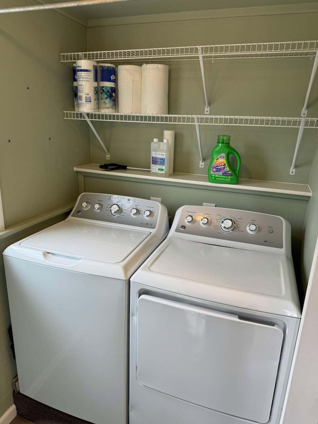 laundry area with laundry area and washer and clothes dryer