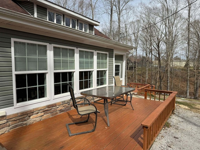 deck with outdoor dining area