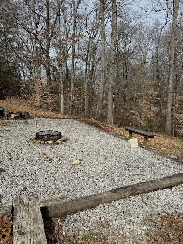 view of yard with an outdoor fire pit