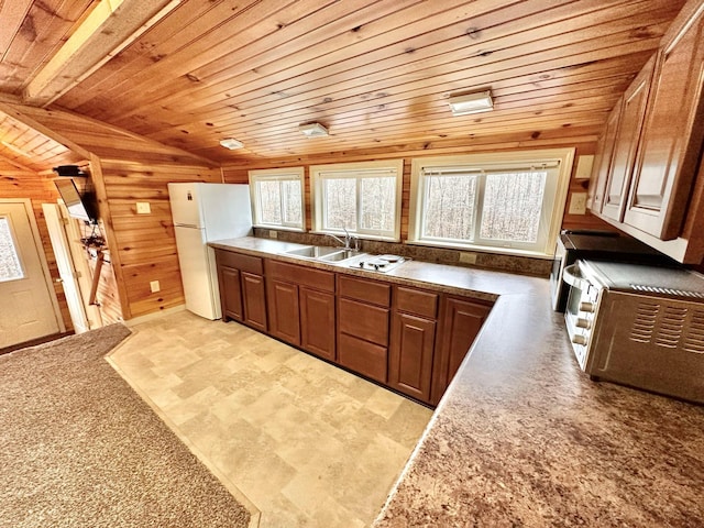 185 Woods Rd, Nancy, KY 42544 - kitchen featuring wood ceiling, a sink, freestanding refrigerator, wooden walls, and vaulted ceiling
