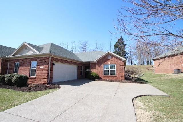 ranch-style home featuring brick siding, roof with shingles, a front yard, a garage, and driveway