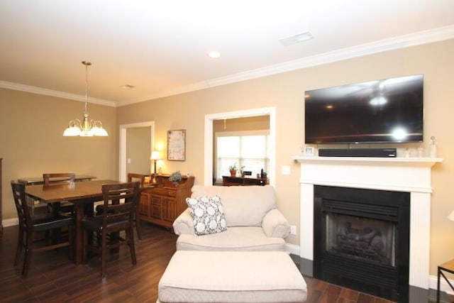 living room with baseboards, dark wood-type flooring, an inviting chandelier, and crown molding