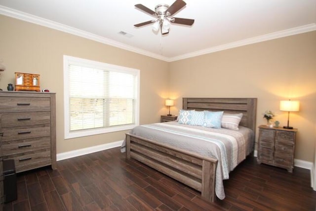 bedroom with ornamental molding, baseboards, and wood finished floors