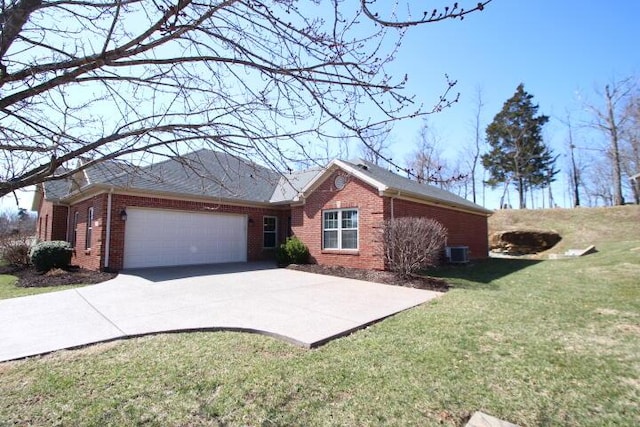 single story home with an attached garage, a front yard, concrete driveway, and brick siding