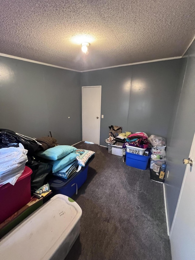 bedroom with carpet, crown molding, and a textured ceiling