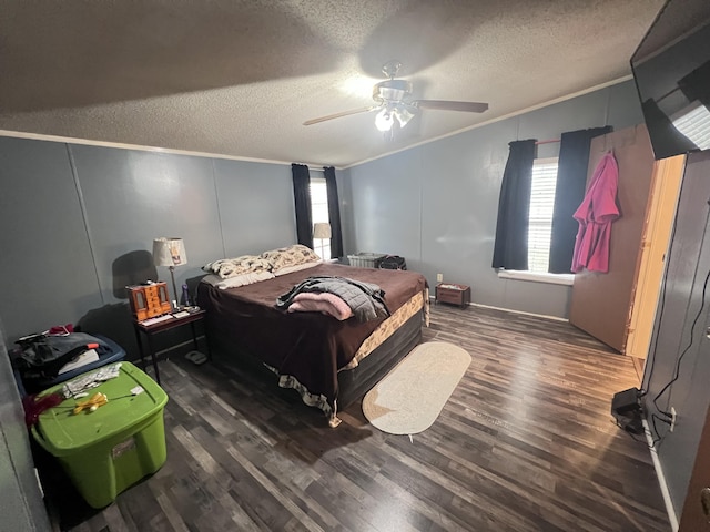 bedroom featuring a textured ceiling, wood finished floors, a ceiling fan, and crown molding