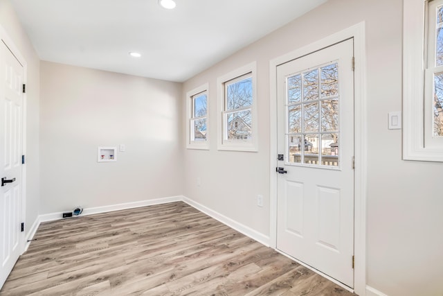 clothes washing area with recessed lighting, laundry area, washer hookup, baseboards, and light wood finished floors