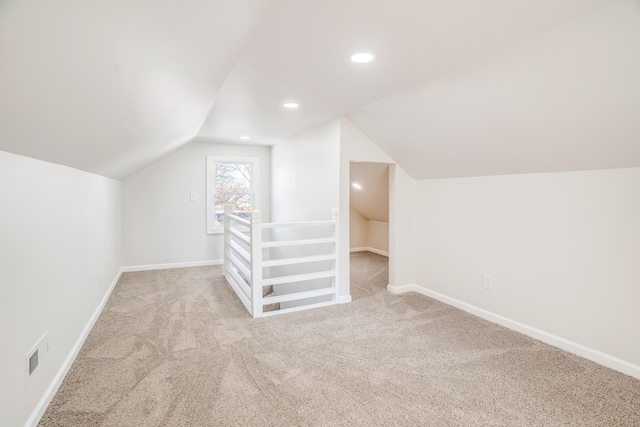 bonus room with carpet, lofted ceiling, and baseboards