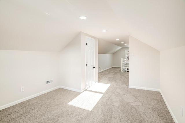 bonus room featuring carpet floors, baseboards, visible vents, and recessed lighting