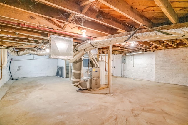 unfinished basement featuring water heater