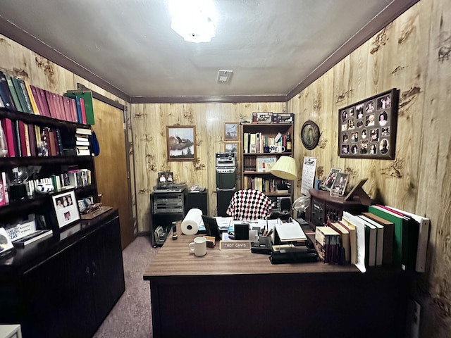 home office featuring carpet floors and wood walls