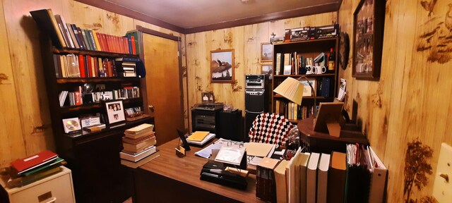 office space featuring wood walls