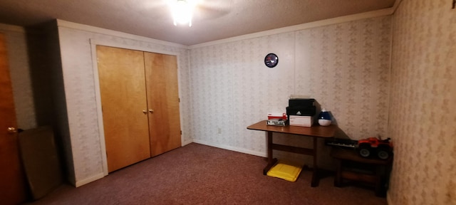 office area with wallpapered walls, baseboards, and carpet flooring