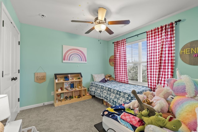 bedroom featuring carpet floors, a closet, a ceiling fan, and baseboards